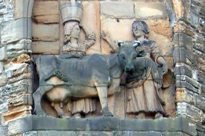 The story of the Dun Cow, as depicted in an eighteenth century panel on the north facade of Durham Cathedral. 